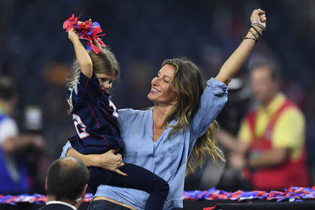 Feb 5, 2017; Houston, TX, USA; Gisele Bundchen and her daughter Vivian Brady celebrate after the game between the Atlanta Falcons and the New England Patriots during Super Bowl LI at NRG Stadium. The Patriots won 34-28. Bob Donnan-USA TODAY Sports