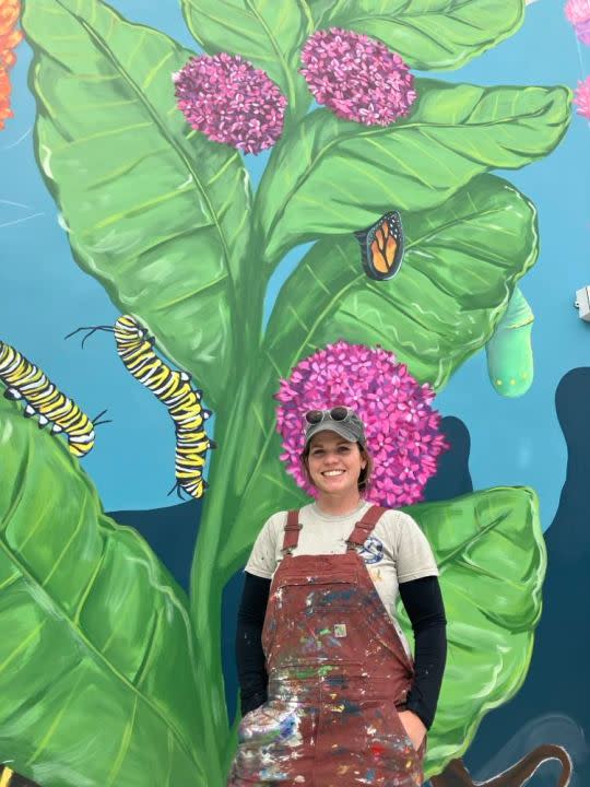 Atlanta Dawn and part of her four-wall mural at the outdoor YWCA child care playground, 513 17th St., Rock Island (photo by Jonathan Turner).