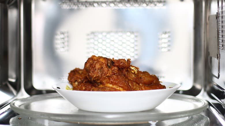 fried chicken with flying crumbs