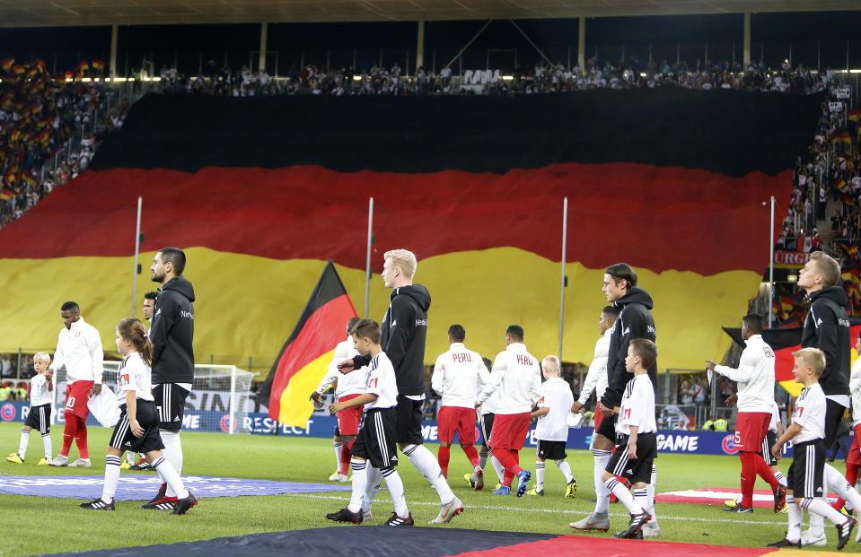 German players enter the pitch for a friendly soccer match between Germany and Peru in Sinsheim, Germany, Sunday, Sept. 9, 2018. (AP Photo/Michael Probst)