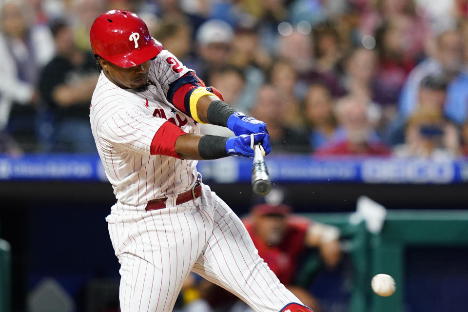 Philadelphia Phillies' Jean Segura breaks his bat hitting into a double play against Washington Nationals pitcher Patrick Corbin during the second inning of a baseball game, Friday, Sept. 9, 2022, in Philadelphia. (AP Photo/Matt Slocum)