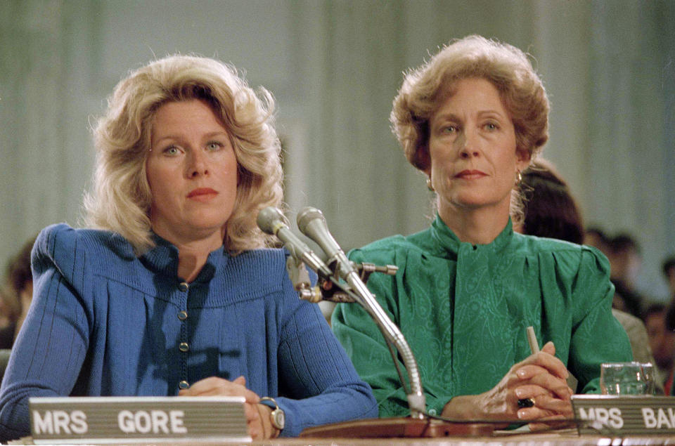 FILE - In this Sept. 19, 1985 file photo, Tipper Gore, wife of Sen. Al Gore Jr. (D-Tenn.), left, and Susan Baker, wife of Secretary of State James A. Baker, appear at a Parents Music Resource Center committee hearing in Washington. The PMRC campaigned to get the music industry to put warning labels on content with explicit lyrics. (AP Photo/Lana Harris)