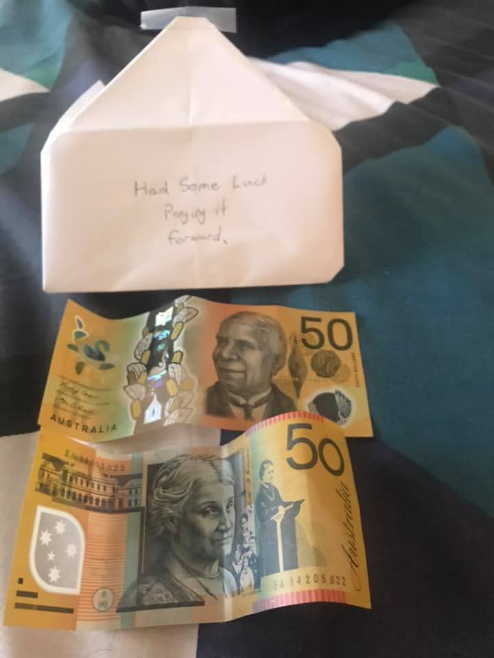 Image of envelope with 'Had some luck paying it forward' written on front. Two $50 Australian bills below.