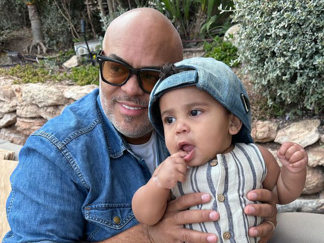 <p>Adrienne Bailon Instagram</p> Israel Houghton and his son Ever