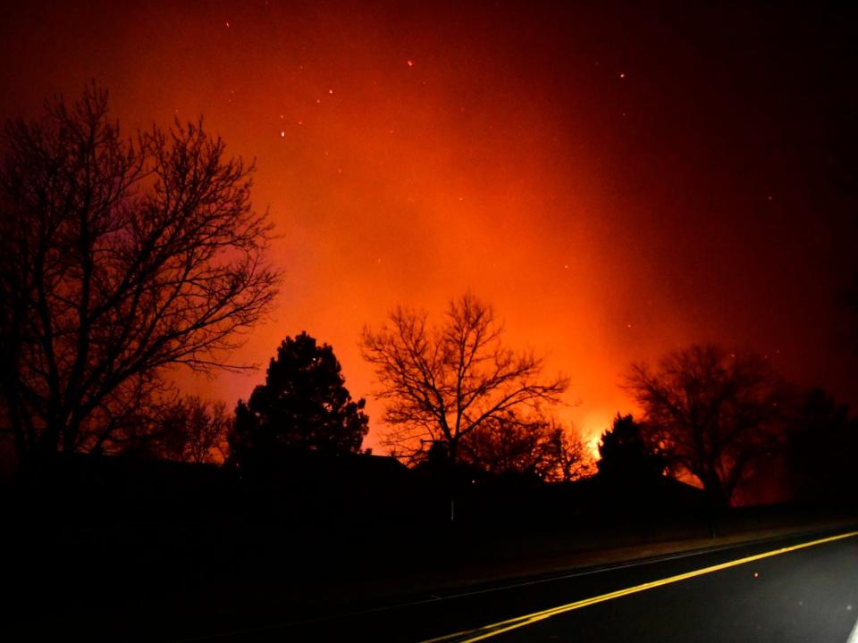Colorado at night with forest fires lighting up the sky.