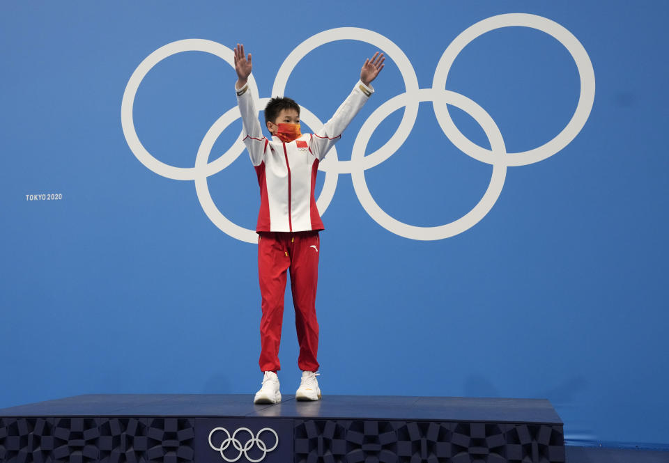 Quan Hongchan of China celebrates after winning the gold medal in women's diving 10m platform final at the Tokyo Aquatics Centre at the 2020 Summer Olympics, Thursday, Aug. 5, 2021, in Tokyo, Japan. (AP Photo/Dmitri Lovetsky)