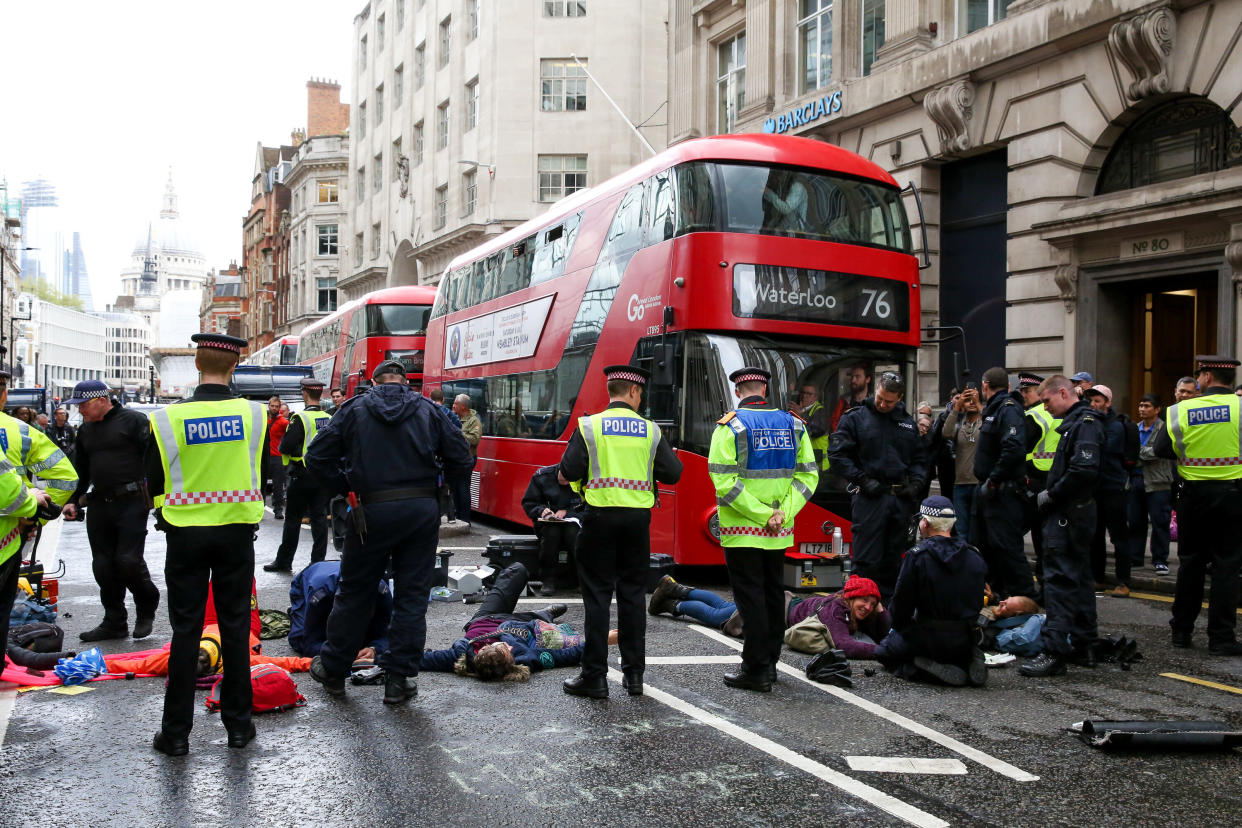  Police officers are seen standing around the environmental activists from Extinction Rebellion Movement Group as they block the Fleet Street during the protest. The eleventh day of the ongoing protest demanding decisive action from the UK Government on the environmental crisis. (Photo by Dinendra Haria / SOPA Images/Sipa USA) 