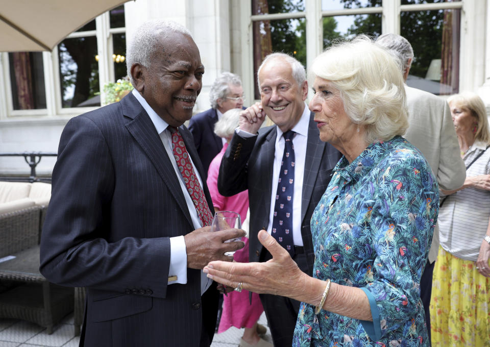 Camilla, Duchess of Cornwall speaks with Trevor McDonald during The Oldie Luncheon, in celebration of Camilla's 75th Birthday at National Liberal Club in London, Tuesday, July 12, 2022. (Chris Jackson/Pool via AP)