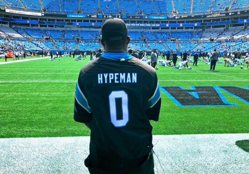 Former Carolina Panthers defensive end Stanley McClover watches the team warm up on Sunday, Sept. 12th. McClover said he chose the number 0 as the team’s “Hypeman” because it represents him coming full circle, back to the Panthers.