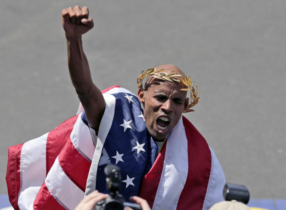 Meb Keflezighi, of San Diego, Calif., celebrates his victory in the 118th Boston Marathon Monday, April 21, 2014 in Boston. (AP Photo/Charles Krupa)