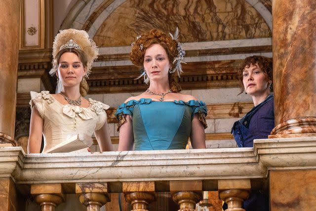 <p>Angus Pigott / Apple TV+ / Courtesy Everett</p> Imogen Waterhouse, Christina Hendricks and Simone Kirby in 'The Buccaneers' on Apple TV+.