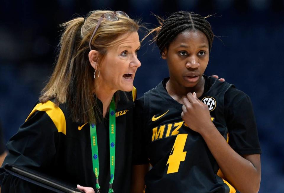 Missouri coach Robin Pingeton talks with Mama Dembele (4) during the first half of a game against Arkansas at the SEC tournament, Thursday, March 3, 2022, in Nashville, Tenn.