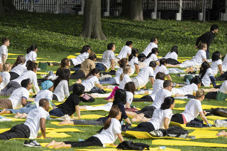 People practice yoga during the International Yoga day event at United Nations headquarters in New York on Wednesday, June 21, 2023. India Prime Minister Narendra Modi has joined diplomats and dignitaries at the United Nations for a morning session of yoga, praising it as “truly universal” and “a way of life.” (AP Photo/Jeenah Moon)