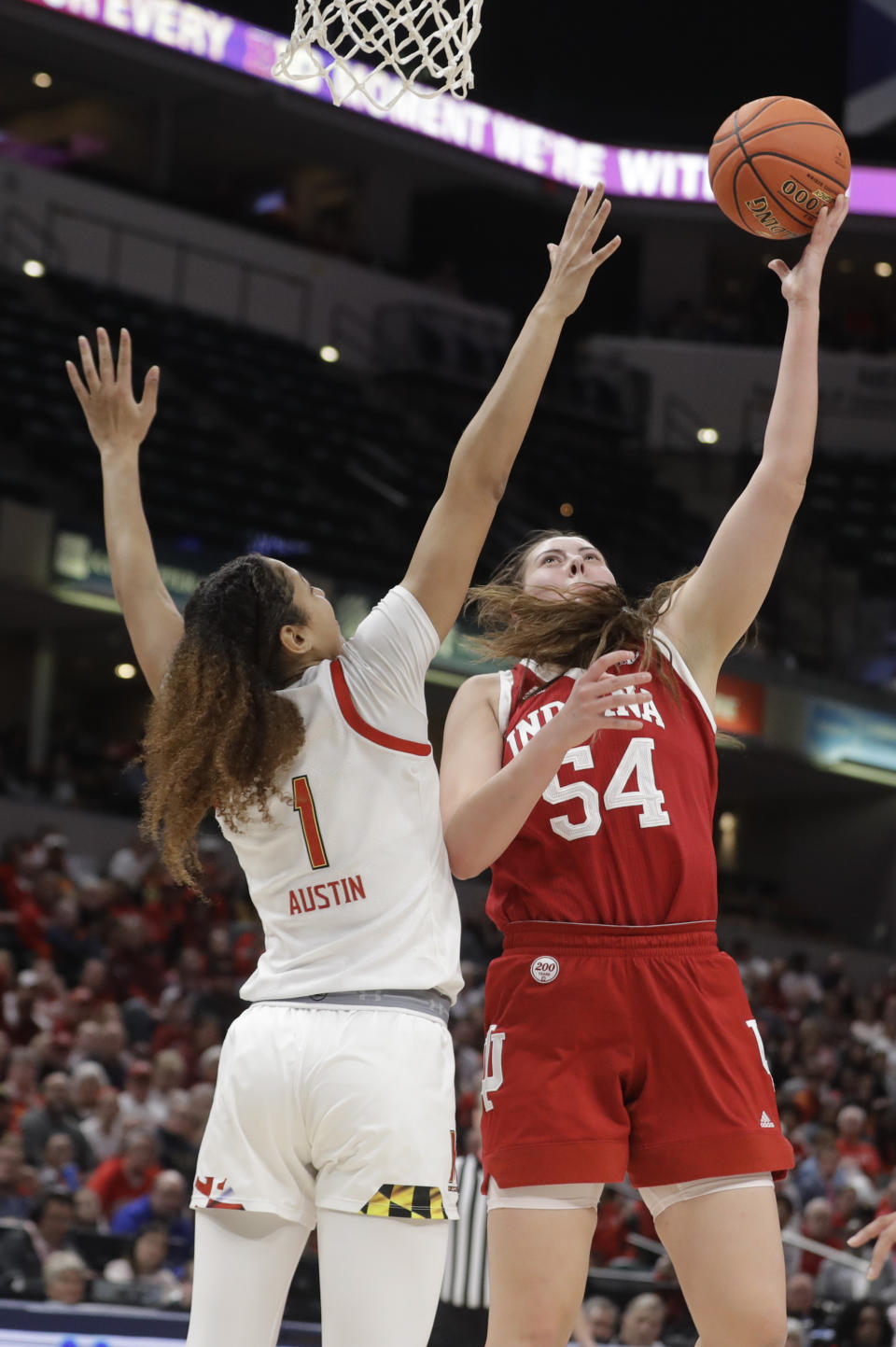 Indiana's Mackenzie Holmes (54) shoots over Maryland's Shakira Austin (1) during the second half of an NCAA college basketball semifinal game at the Big Ten Conference tournament, Saturday, March 7, 2020, in Indianapolis. Maryland won 66-51. (AP Photo/Darron Cummings)