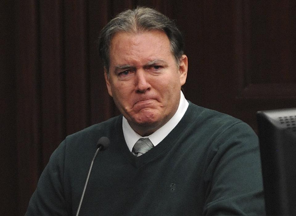 Defendant Michael Dunn reacts on the stand during testimony in his own defense during his murder trial in Duval County Courthouse in Jacksonville, Florida, in this file photo taken February 11, 2014. Dunn faces life in prison at his sentencing on Friday for first-degree murder in the shooting death of an unarmed black teenager in an argument over loud rap music. REUTERS/Bob Mack/Pool/Files (UNITED STATES - Tags: CRIME LAW)