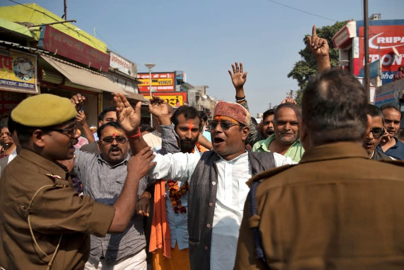 Hindu devotees celebrate after Supreme Court's verdict on a disputed religious site, in Ayodhya