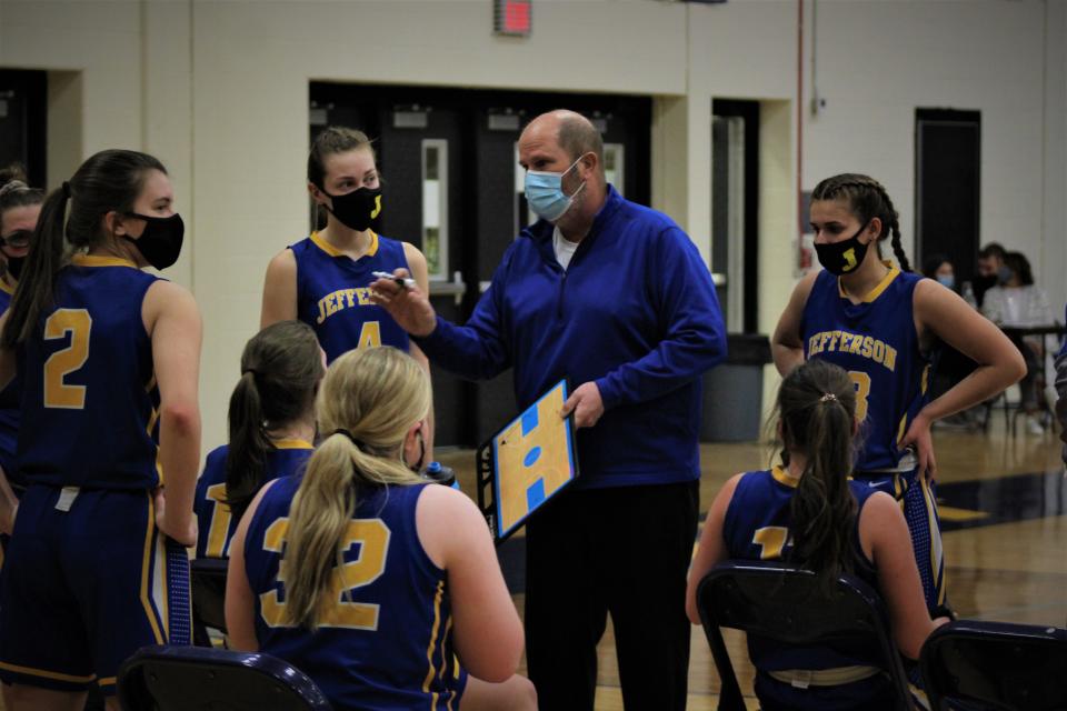 Jefferson coach Bryan Parran talks to his team during a timeout last season. The Bears opened the 2021-22 season with a victory over Summerfield.