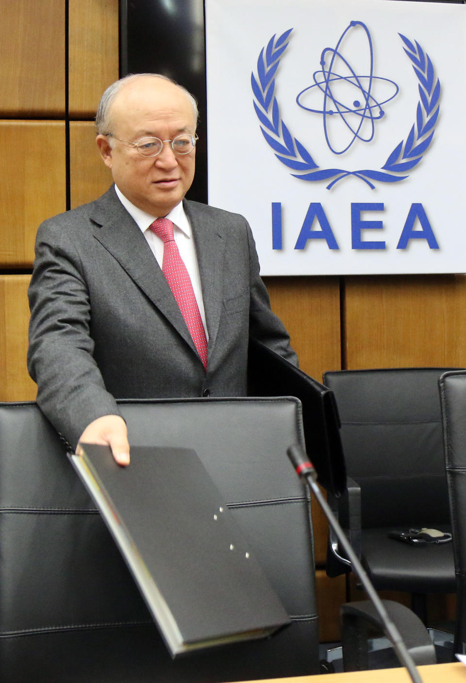 Director General of the International Atomic Energy Agency, IAEA, Yukiya Amano of Japan waits for the start of the IAEA board of governors meeting at the International Center in Vienna, Austria, Monday, March 3, 2014. The head of the U.N. nuclear agency says Iran has cut its stock of uranium that is closest to atomic weapons-grade. Under an interim deal with six world powers, Iran is to dilute half of its 20-percent-enriched uranium to a lower grade suitable for use as reactor fuel. Amano told the agency's 35-nation board Monday that that process "has reached the halfway mark." (AP Photo/Ronald Zak)