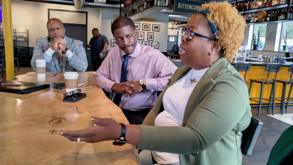 County Executive David Crowley, center, hosts a discussion over coffee with Black business owners and advocates to see how the county can be a better resource for them. Angela Mallett, right, of HoneyBee Sage Wellness & Apothecary spoke about the challenges of starting a business with limited support or knowledge of the licensing process. Ugo Nwagbaraocha. left, of the Wisconsin chapter of the National Association of Minority Contractors looks on