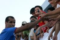 FILE PHOTO: Former Brazil international Rivaldo greets fans in Tashkent at the Uzbek soccer club Bunyodkor