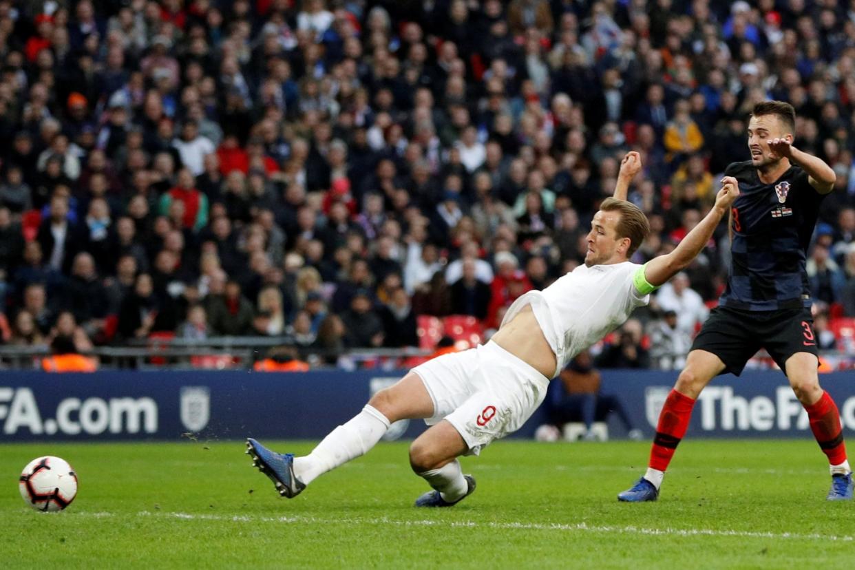 King Kane: England’s captain slides home the late winner as Croatia’s defenders look on: REUTERS