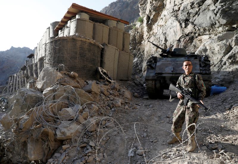 An Afghan National Army soldier stands guard at the check post at Mahipar, on Jalalabad-Kabul highway Afghanistan