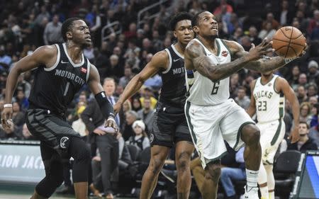 Dec 5, 2018; Milwaukee, WI, USA; Milwaukee Bucks guard Eric Bledsoe (6) prepares to shoot the ball past Detroit Pistons guard Ish Smith (14) in the second quarter at the Fiserv Forum. Benny Sieu-USA TODAY Sports