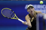 Caroline Wozniacki, of Denmark, returns a shot to Danielle Collins, of the United States, during the second round of the U.S. Open tennis tournament Thursday, Aug. 29, 2019, in New York. (AP Photo/Adam Hunger)