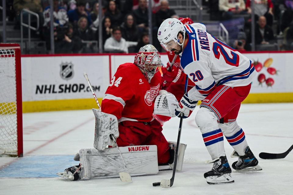 Rangers left wing Chris Kreider scores as Red Wings goaltender Alex Lyon tends the net during the third period of the Wings' 4-3 loss on Friday, April 5, 2024, at Little Caesars Arena.
