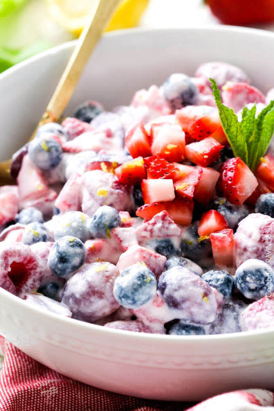 <p>Fresh berry salad is one of the best fruit salads you will ever make! Smothered in sweet and tangy, incredibly creamy honey mascarpone that tastes indulgently gourmet but takes minutes to whip up! Perfect for special occasions!</p><p><a href="http://www.carlsbadcravings.com/berry-salad-in-honey-mascarpone-recipe/" rel="nofollow noopener" target="_blank" data-ylk="slk:Get the recipe here!;elm:context_link;itc:0;sec:content-canvas" class="link "><em><strong>Get the recipe here!</strong></em></a></p>