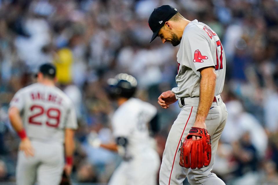 Red Sox starting pitcher Nathan Eovaldi hangs his head as the Yankees' Giancarlo Stanton runs the bases after hitting a three-run home run on July 15.