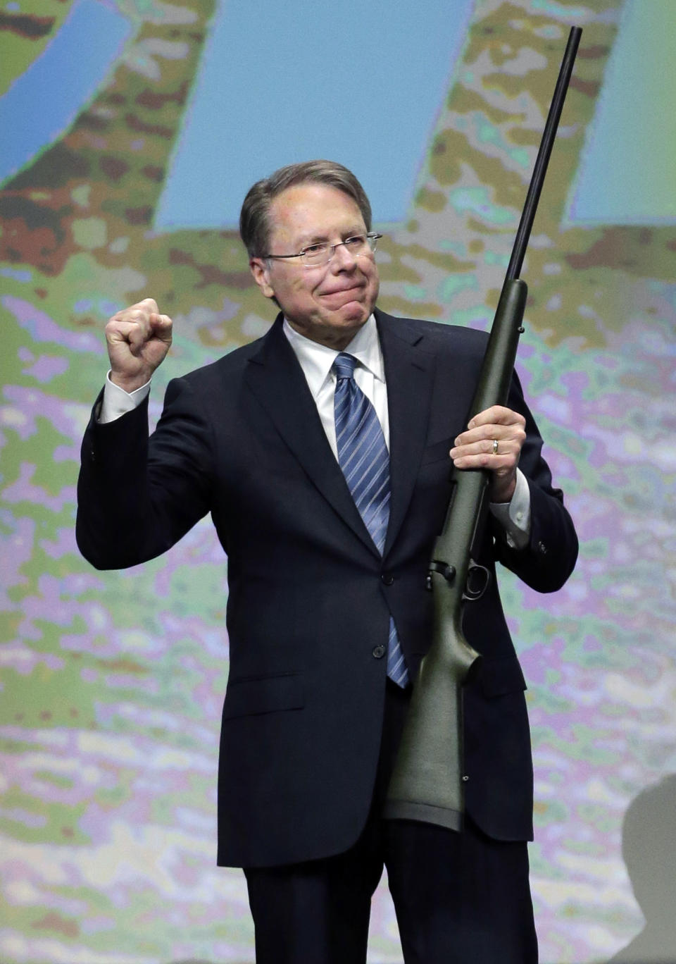 FILE - In this Feb. 23, 2013, file photo, Wayne LaPierre, executive vice president of the National Rifle Association, holds a custom 300 Remington ultra mag during a gun auction after speaking during the Western Hunting & Conservation Expo Banquet at the Salt Palace Convention Center in Salt Lake City. In the latest national furor over mass killings, the tremendous political power of the NRA is likely to stymie any major changes to gun laws. The man behind the organization is LaPierre, the public face of the Second Amendment with his bombastic defense of guns, freedom and country in the aftermath of every mass shooting. (AP Photo/Rick Bowmer, File)