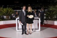 Felix van Groeningen, left, and Charlotte Vandermeersch, winners of the jury prize for 'Eight Mountains' pose for photographers during the photo call following the awards ceremony at the 75th international film festival, Cannes, southern France, Saturday, May 28, 2022. (Photo by Vianney Le Caer/Invision/AP)