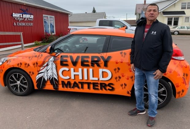 Stephen Bernard didn't want the conversation to stop about residential schools and the possible unmarked graves across the county, so he decided to turn his car into a billboard to raise awareness. (Tony Davis/CBC - image credit)