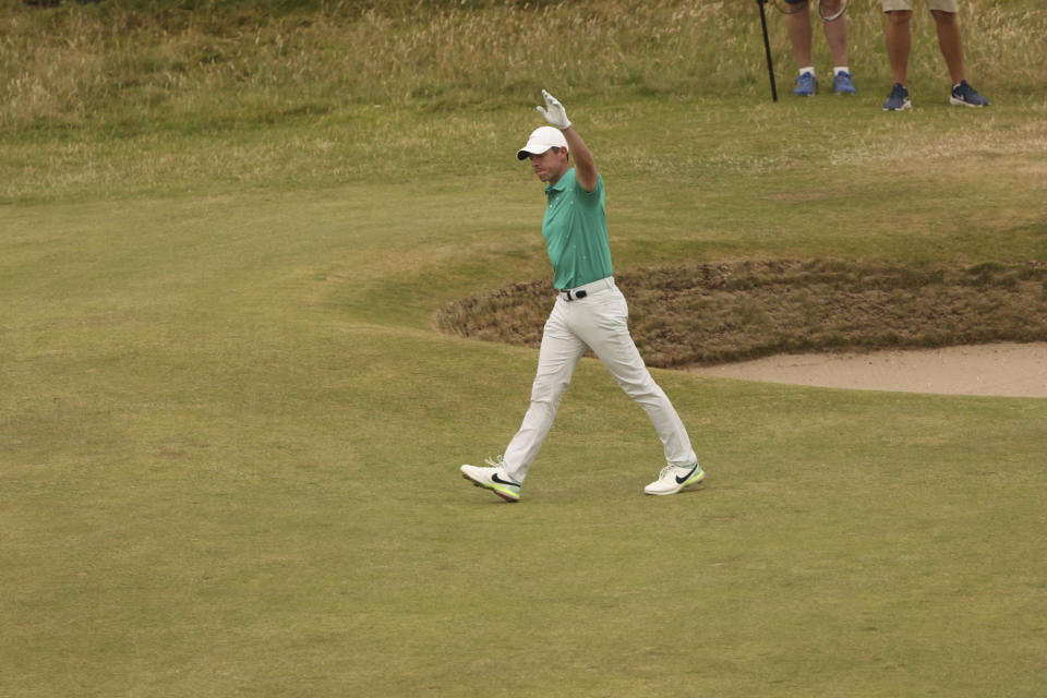 Rory McIlroy of Northern Ireland reacts after holing out of the bunker on the 10th hole during the third round of the British Open golf championship on the Old Course at St. Andrews, Scotland, Saturday July 16, 2022. (AP Photo/Peter Morrison)