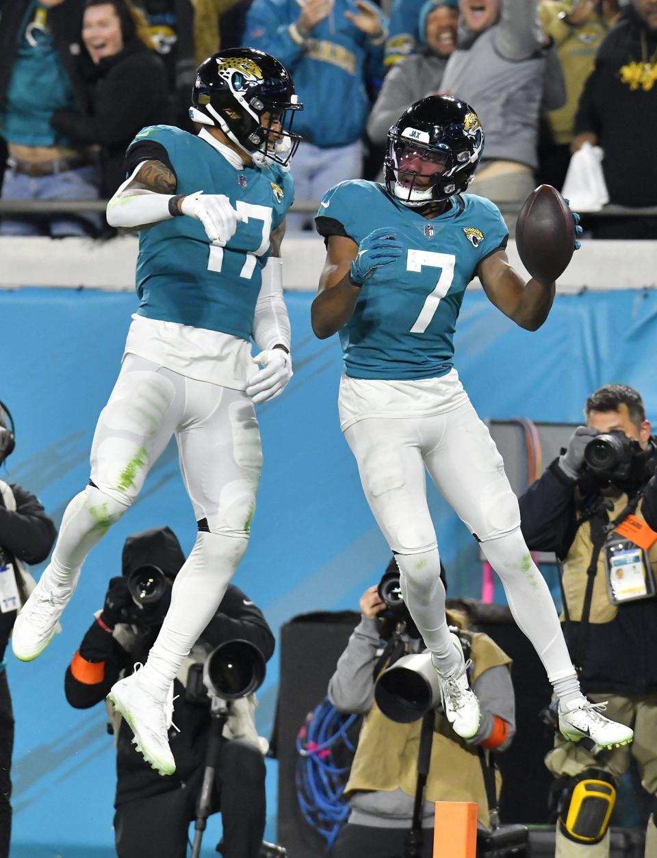 Jacksonville Jaguars tight end Evan Engram (17) celebrates with teammate wide receiver Zay Jones (7) after Jones' late third quarter touchdown. The Jacksonville Jaguars hosted the Los Angeles Chargers in their first round playoff game Saturday, January 14, 2023 at TIAA Bank Field in Jacksonville, Fla. The Jaguars trailed 27 to 7 at the half but came back to win the game 31 to 30. [Bob Self/Florida Times-Union]