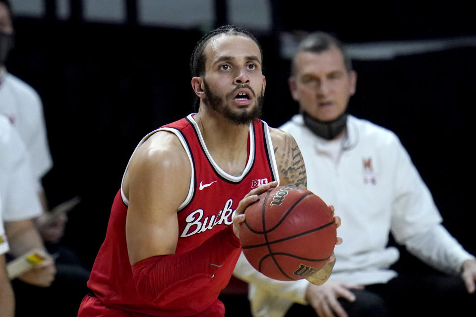 Ohio State guard Duane Washington Jr. prepares to shoot a basket against Maryland during the first half of an NCAA college basketball game, Monday, Feb. 8, 2021, in College Park, Md. (AP Photo/Julio Cortez)