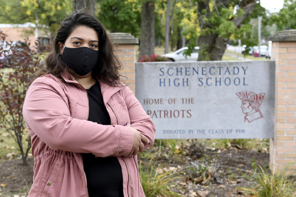 Kristina Negron poses for a photograph Tuesday, Sept. 29, 2020, in Schenectady, N.Y. Negron was laid off from her job as an aide for a special education class at Schenectady High School due to budget cuts. (AP Photo/Hans Pennink)