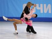 Meryl Davis (R) and Charlie White of the U.S. compete during the figure skating ice dance short dance program at the Sochi 2014 Winter Olympics, February 16, 2014. REUTERS/David Gray