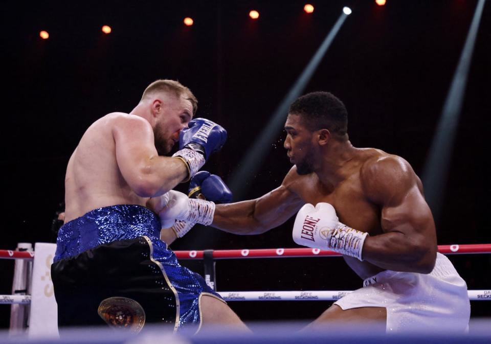 Joshua, right, was on the front foot for all five rounds against Wallin (Reuters)