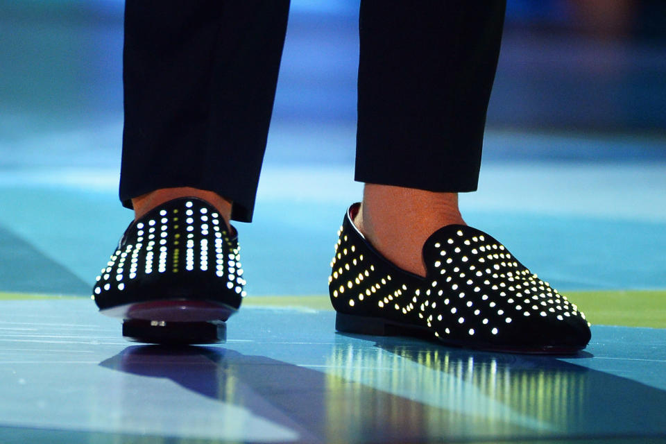 Host Nick Cannon (shoe detail) perform onstage during the 5th Annual TeenNick HALO Awards at Hollywood Palladium on November 17, 2013 in Hollywood, California