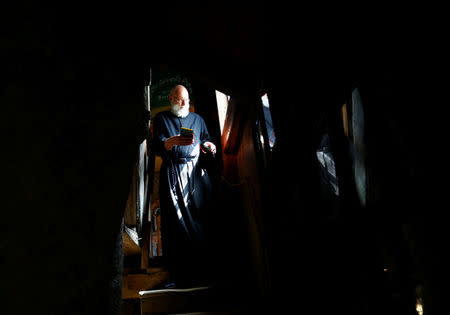 Hermit Stan Vanuytrecht of Belgium walks down the stairs in the hermitage in Saalfelden, Austria, May 22, 2017. Picture taken May 22, 2017. REUTERS/Leonhard Foeger