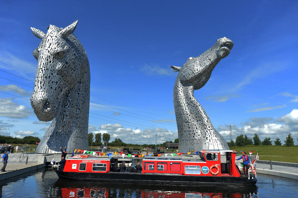 FALKIRK SCOTLAND  JULY 05 Her Majesty Queen Elizabeth II and Prince Philip Duke of Edinburgh arrive on a canal boat at the Kelpies on July 5 2017 in Falkirk Scotland Queen Elizabeth II and Prince Philip Duke of Edinburgh visited the new section the Queen Elizabeth II Canal built as part of the 43m Helix project which features the internationallyacclaimed 30metrehigh Kelpies sculptures Photo by Mark RunnaclesGetty Images