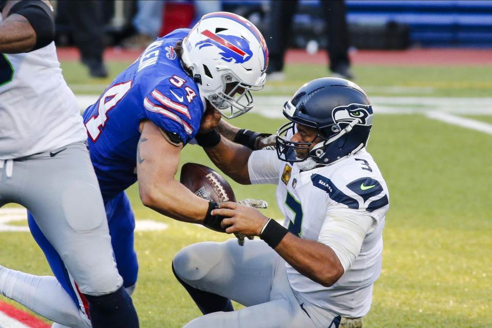 Buffalo Bills' A.J. Klein (54) strip sacks Seattle Seahawks quarterback Russell Wilson (3) during the second half of an NFL football game Sunday, Nov. 8, 2020, in Orchard Park, N.Y. Klein recovered the ball on the play. (AP Photo/Jeffrey T. Barnes)