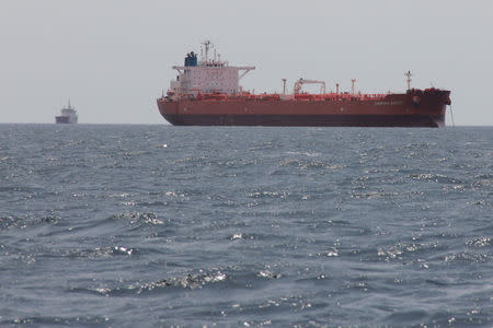 The oil tanker Caspian Galaxy (R) sits anchored near Amuay beach, in Punto Fijo, Venezuela. REUTERS/Stringer