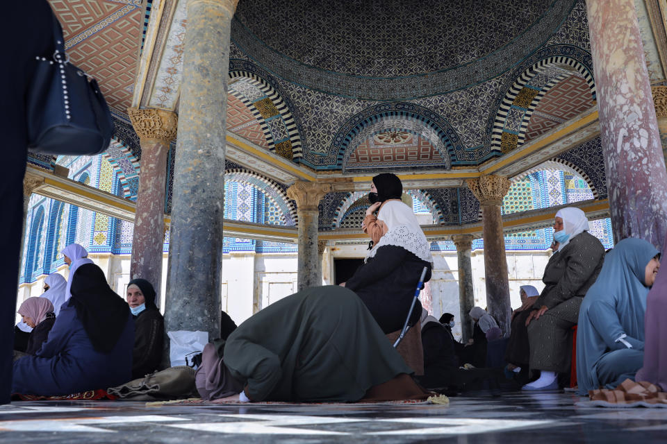 Palestinian women pray during the first Friday of the holy month of Ramadan at the Al Aqsa Mosque compound in Jerusalem's old city, Friday, April. 16, 2021. (AP Photo/Mahmoud Illean)