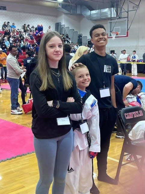 Devon Biggs (right) earned his black belt in Tae Kwon Do at age 10. He was given an honorary second degree black belt after his death in May 2023, his mother said. The 15-year-old Eastmoor Academy freshman had been training to test for the belt before his death.