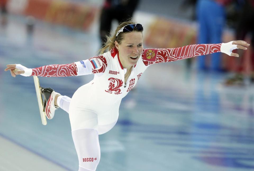 Russia's Olga Graf celebrates her time after competing in the women's 3,000-meter speedskating race at the Adler Arena Skating Center during the 2014 Winter Olympics, Sunday, Feb. 9, 2014, in Sochi, Russia. (AP Photo/Matt Dunham)