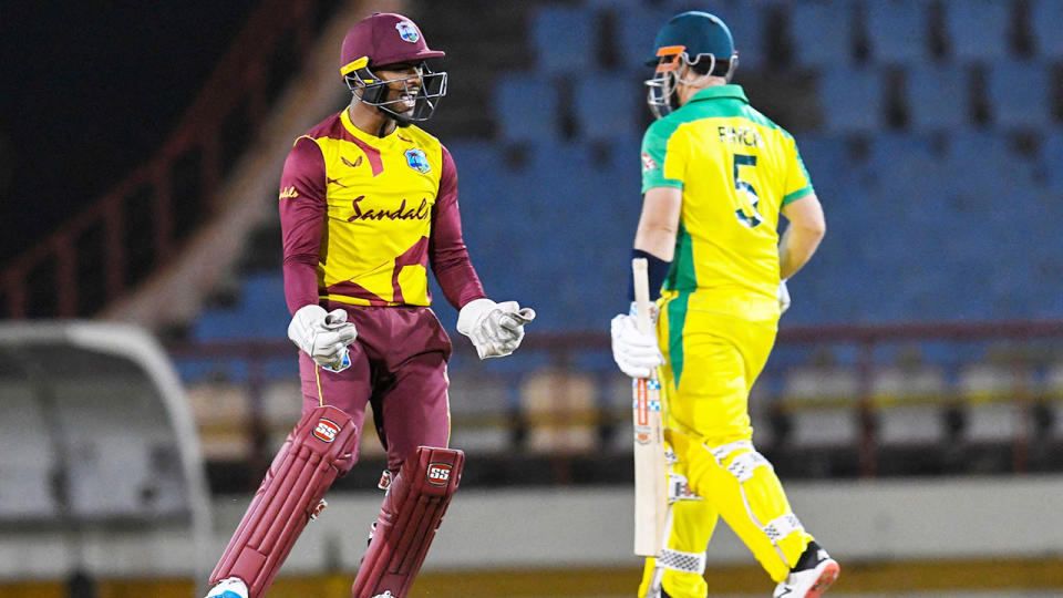 Nicholas Pooran celebrates after the dismissal of Aaron Finch. (Photo by RANDY BROOKS/AFP via Getty Images)