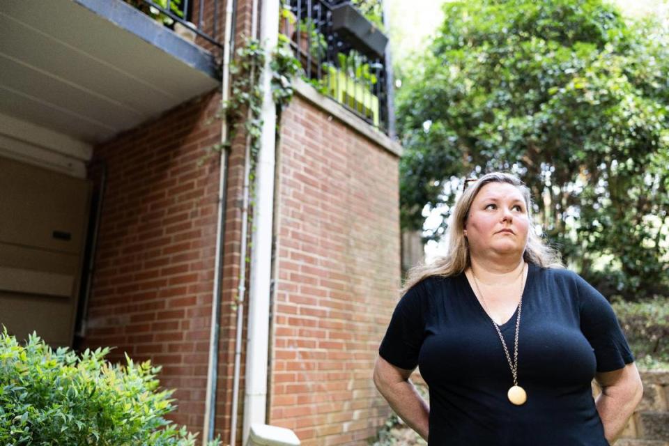 Jennifer Jackson, shown standing outside her condo building in Charlotte, said her fight with her HOA has taken a big financial and emotional toll. “The only people who can challenge this stuff are people with very deep pockets,” she said